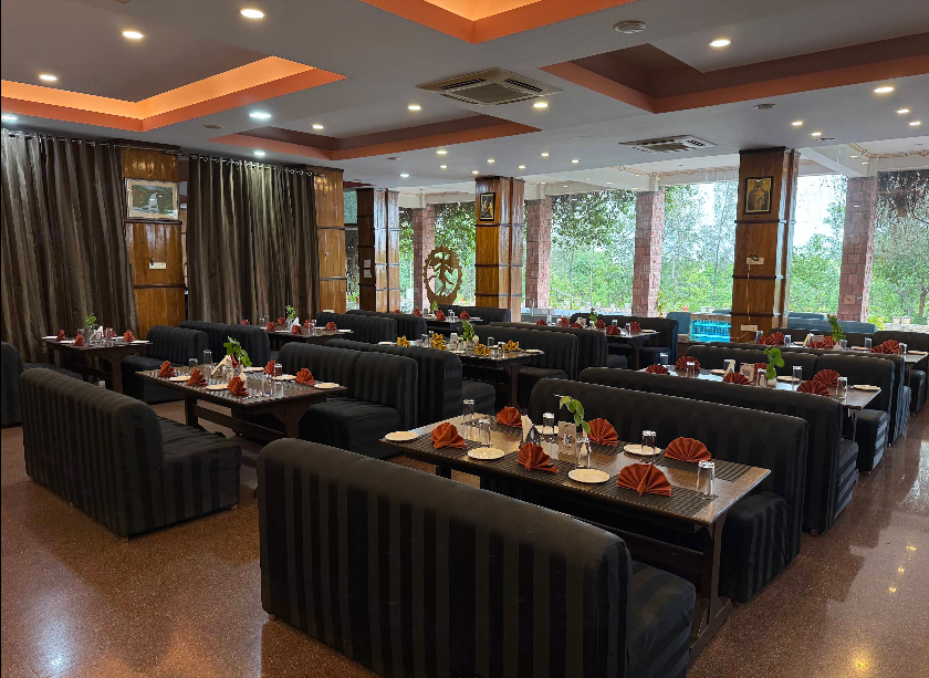 Elegant dining hall of the multi-cuisine restaurant at Kanthi Resorts hotel near Pattadakal
